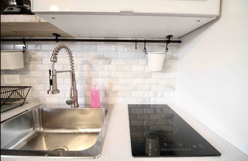 Mayaguez Pueblo Apartment | 1.6 Modern Farmhouse with Generator Balcony