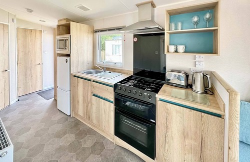 Cross Inn House | 12ft-wide caravan with one double and one twin.