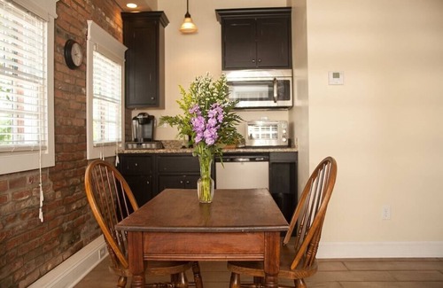 St. Charles Cottage | 1830's Luxury Brick Cottage, Cozy Fireplace, right off the Cobblestone Streets!