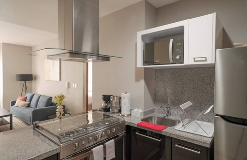 Ampliacion Granada Condo | 1BR|1BA Apartment W/pool, gym, high speed WiFi