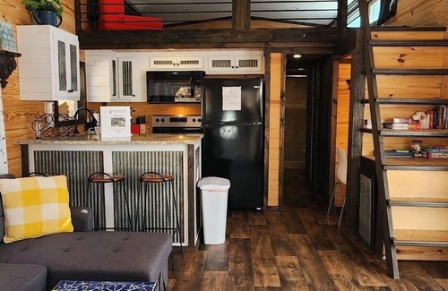 Mill Spring House | 2-story tiny home nestled on the creek, quick walk to pool and playground, private firepit, sleeps 7.