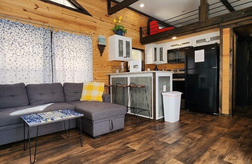 Mill Spring House | 2-story tiny home nestled on the creek, quick walk to pool and playground, private firepit, sleeps 7.