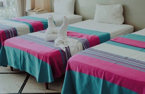 Merida Municipality Hotel | 2 Triple Rooms at Mérida, Perfect for Families & Poolside Relaxation