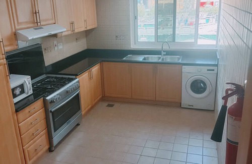 Al Muraqqabat Apartment | 2015 Deluxe 15 minutes to Burj Khalifa by Metro