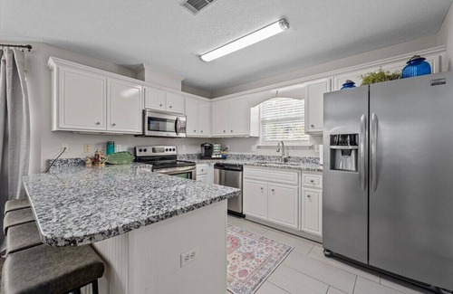 National Hills House | 3 bedroom, 2.5 bathroom patio home with an inground pool. The sleeping arrangements at this property include three queen beds and a futon located in the second living room.