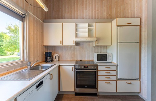 Norderteil House | 4-person vacation home with wood-burning stove, canoe and wonderful lake view in Otterndorf