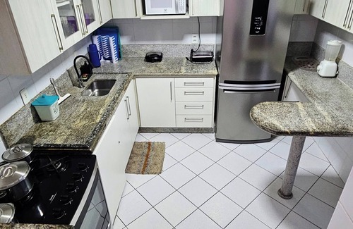 Praia do Morro Apartment | 4 suites facing the sea with barbecue, 2 parking spaces, Wi-Fi