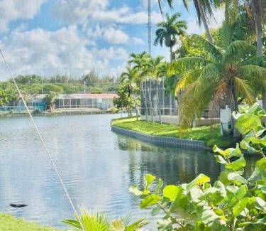 Miramar House | 4bdrm Waterfront salt water Pool home with Outdoor theater Game Rm Make up vanities in every room Perfect for Game days and concerts trips to Miami Hard rock stadium and hotel 15 mins away