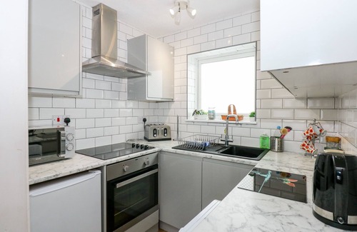 Corton Cottage | 63 THE WATERSIDE HOLIDAY PARK, pet friendly, with pool in Corton