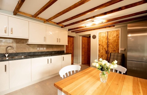 Aberporth House | A beautifully renovated farm house on the coast with a hot tub & outdoor bar