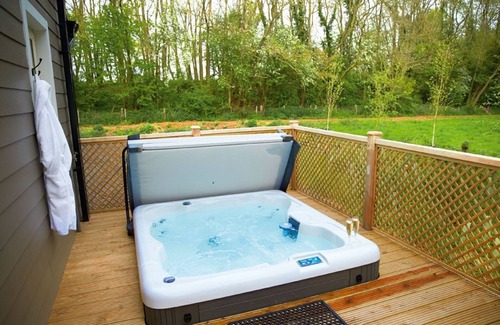 Pattiswick Cabin | A delightful lodge with hot tub on Wakes Hall Farm is a haven of peace in 500 acres of private land