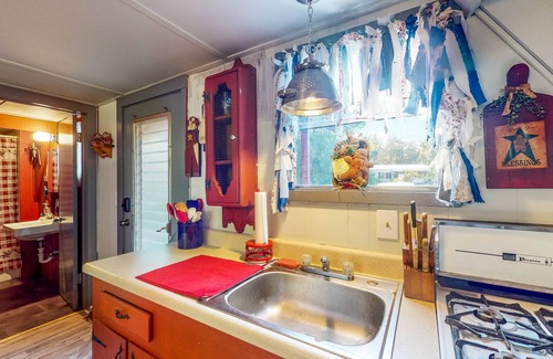 Bushnell Cabin | Adorable A-Frame with Riverfront Yard, Fishing Pier, & Firepit