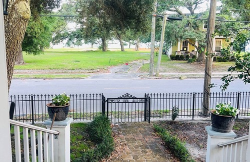 Gulfport House | After beach time come back to an outdoor soaking tub in privacy fenced back yard