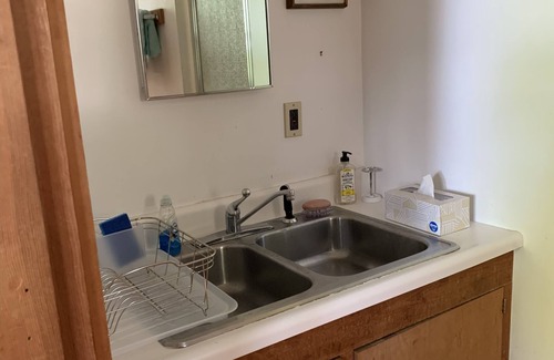 Gloucester Cottage | Airy, book-lined cottage on historic seaside estate with private beaches & more