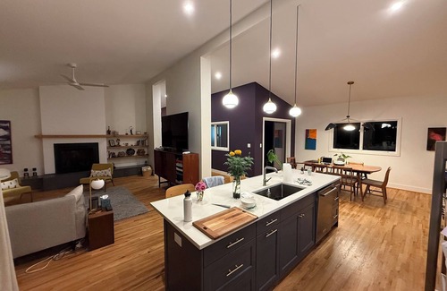 Athens House | Amazing open high ceiling big windows large common room for group celebration.