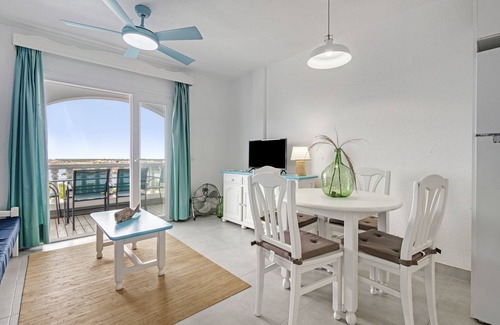 Arenal d'en Castell Apartment | Apartment 'Apartamento 103 Castell Sol' with Shared Pool, Private Terrace and Wi-Fi