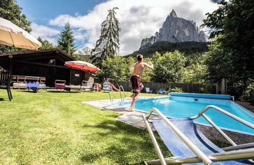 Siusi Apartment | Apartment "Bergfrieden 2 B" with Mountain View, Pool, Wi-Fi, Terrace & Garden