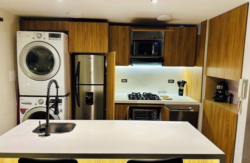 Calle 100 Apartment | Apt with private jacuzzi sauna sauna fireplace cinema and gym king size bed 93 park