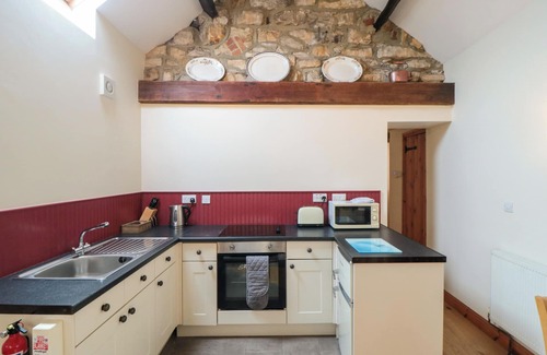 Whitby Cottage | BARN COTTAGE, pet friendly, with a garden in Robin Hood’s Bay