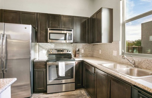 Cary Apartment | Barsala l 2BD Oasis at Arboretum: Stylish & Scenic Views