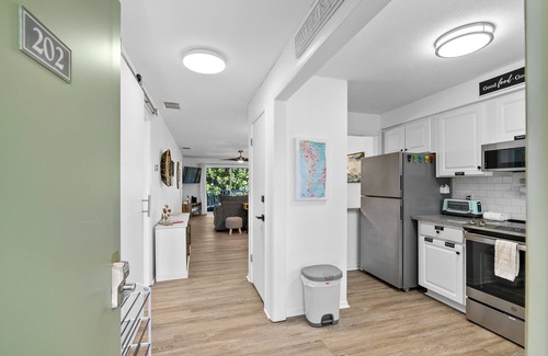 Holmes Beach Condo | Beach and Heated Pool at Nautilus 202