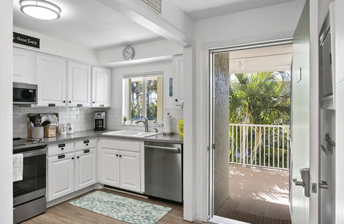 Holmes Beach Condo | Beach and Heated Pool at Nautilus 202