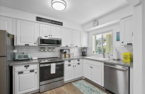 Holmes Beach Condo | Beach and Heated Pool at Nautilus 202