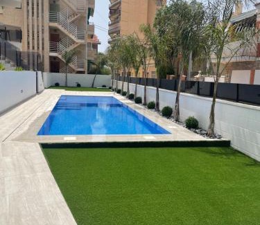 Santiago de la Ribera Apartment | Beach bungalow with swiming pool and long terrace