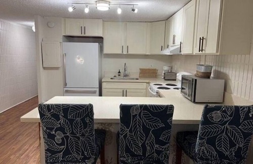 Punaluu Condo | Beach Front Condo w/Beautiful Sunrises on Private Sandy Beach with Calm & Gentle Waves