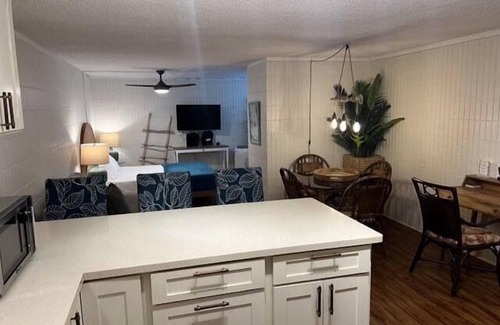 Punaluu Condo | Beach Front Condo w/Beautiful Sunrises on Private Sandy Beach with Calm & Gentle Waves