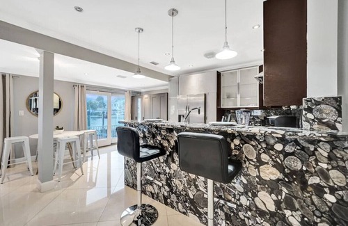 Hendricks and Venice Isles Apartment | Beach Isles: Modern 1BR Waterfront Apartment with Patio