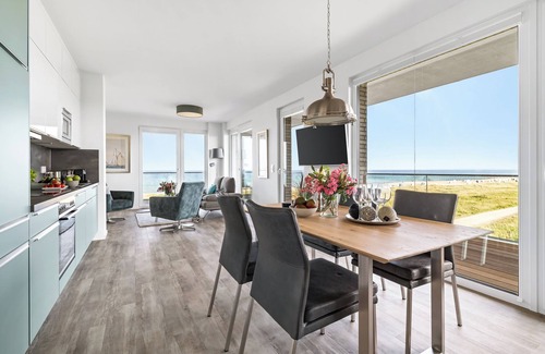 Olpenitz Apartment | "BeachWaveFour": Holiday apartment right on the beach with sauna, balcony & Baltic Sea view