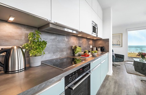 Olpenitz Apartment | "BeachWaveFour": Holiday apartment right on the beach with sauna, balcony & Baltic Sea view