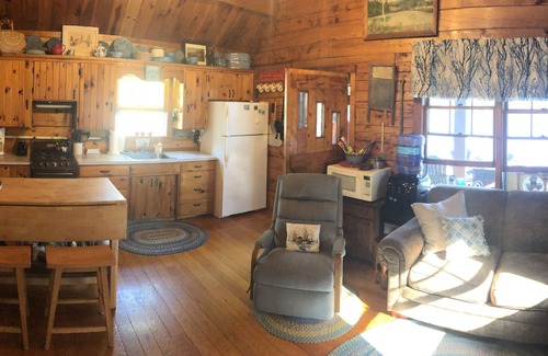 Dedham Cabin | Beautiful cozy Maine log cabin on the water.