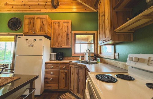 Gould City Cottage | Beautiful Lake House With Outdoor Firepit and Great Fishing!