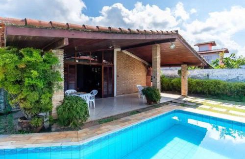 Praia Grande Villa | BH4 · BH4: CASA COM PISCINA AO LADO DA PRAIA GRANDE