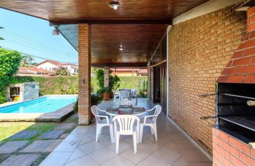 Praia Grande Villa | BH4 · BH4: CASA COM PISCINA AO LADO DA PRAIA GRANDE