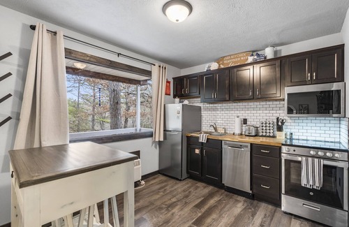 Branson Cabin | Bluebird Cottage - Hot Tub - Pool - Coffee - Fire Pit - less than 1 mile to SDC!