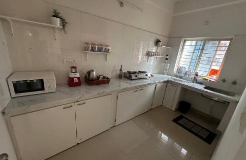 Shaikpet Apartment | Boho Nest -Aesthetic 2BHK with Smart TV, Kitchen, Cozy Bedrooms & Peaceful Ambience