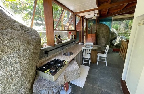 Florianopolis Cabin | Pyramid house covered in quartz. Space for healing and regeneration connections.
