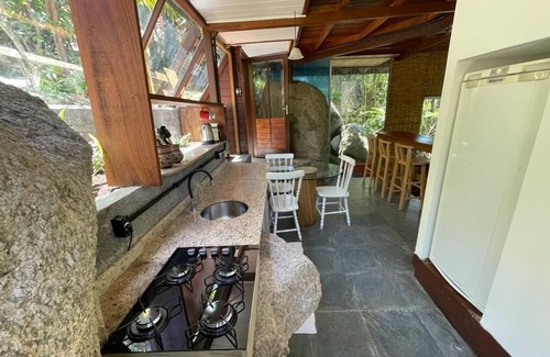 Florianopolis Cabin | Pyramid house covered in quartz. Space for healing and regeneration connections.