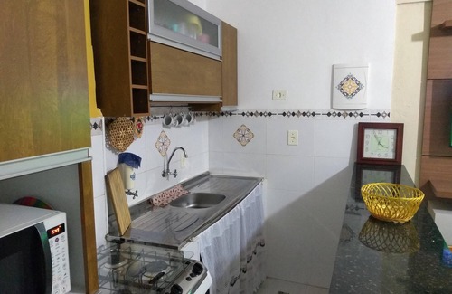 Jose Menino Apartment | BUILDING FACING THE SEA AND OUTLET - WI-FI, SUN UMBRELLA, COOLER AND CHAIRS