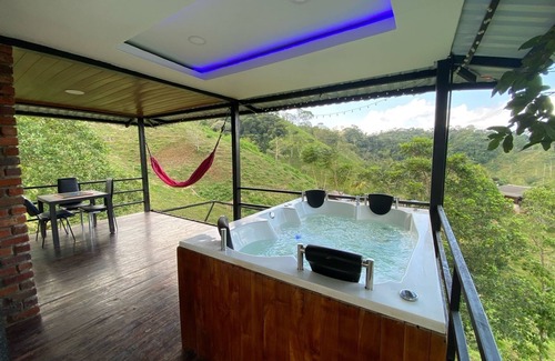 Samana Ski Chalet | Cabin in Norcasia Jacuzzi, spring water pool and extreme attractions option.