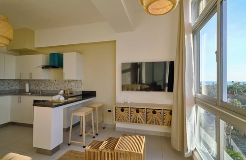 Quisqueya Apartment | Caribbean Sunset Soak Apt.In the center of town, steps from the Juan Dolio Beach