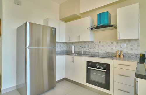 Quisqueya Apartment | Caribbean Sunset Soak Apt.In the center of town, steps from the Juan Dolio Beach