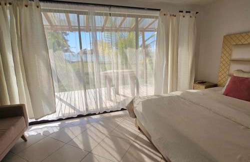 Monitos House | Casa Suite Palmar del viento FRENTE, FRENTE AL MAR by Amauna