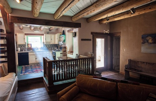 Valdez House | Casita de Colores secluded 2 story adobe amidst serene pine and ponderosa trees.