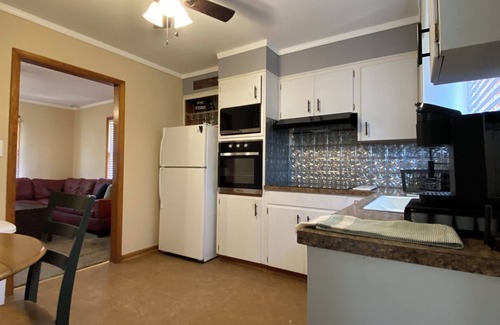 Atchison House | Charming 2-bedroom house in Atchison on quiet brick and tree lined street.