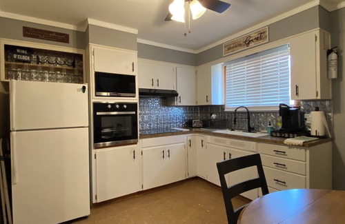 Atchison House | Charming 2-bedroom house in Atchison on quiet brick and tree lined street.