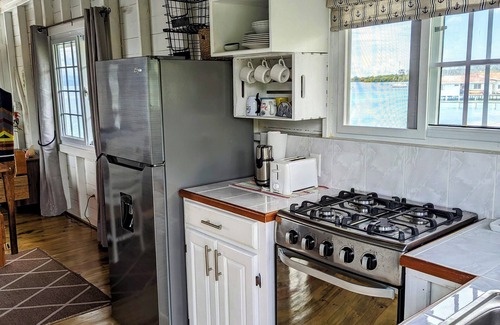 Big Bight Apartment | Charming bungalow over a coral reef in the Caribbean sea with stunning sunsets!